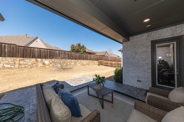 view of patio / terrace featuring a fenced backyard and an outdoor hangout area