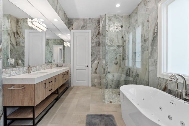 bathroom with a soaking tub, tile walls, a sink, and a stall shower