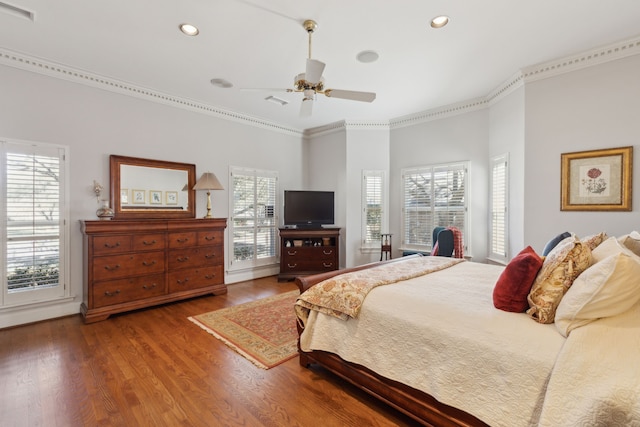 bedroom featuring recessed lighting, visible vents, crown molding, and wood finished floors