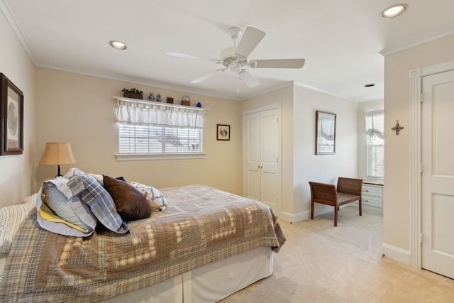 bedroom with recessed lighting, a closet, ornamental molding, light carpet, and baseboards