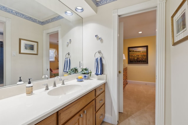 bathroom with recessed lighting, baseboards, and vanity