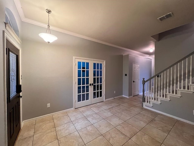 foyer entrance with french doors, visible vents, ornamental molding, baseboards, and stairs