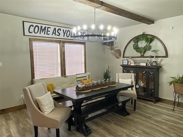 dining area featuring a notable chandelier, beamed ceiling, wood finished floors, and baseboards