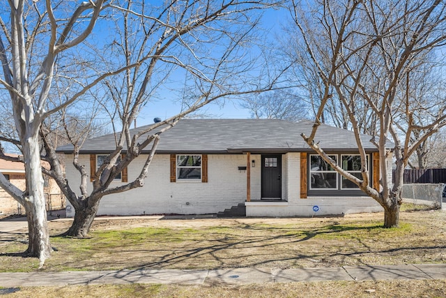 ranch-style home with brick siding, crawl space, and fence