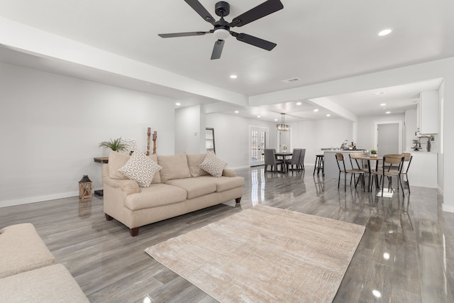 living area with visible vents, baseboards, a ceiling fan, wood finished floors, and recessed lighting