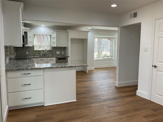 kitchen with white cabinetry, visible vents, stainless steel appliances, and a sink