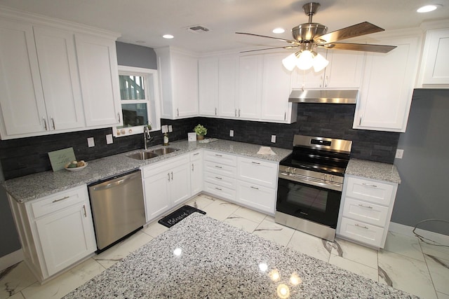 kitchen featuring visible vents, marble finish floor, stainless steel appliances, under cabinet range hood, and a sink