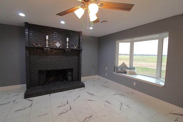 unfurnished living room with recessed lighting, a fireplace, visible vents, baseboards, and marble finish floor