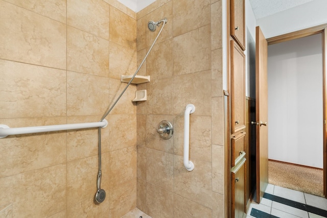 full bath with a tile shower