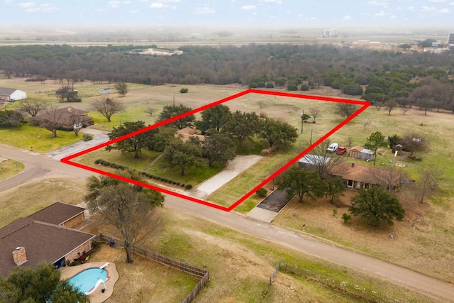 birds eye view of property with a rural view