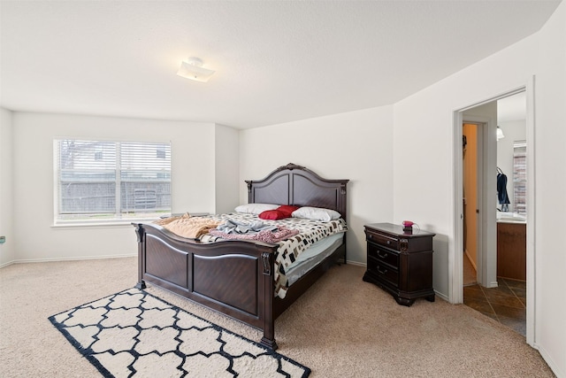 bedroom featuring carpet flooring and baseboards