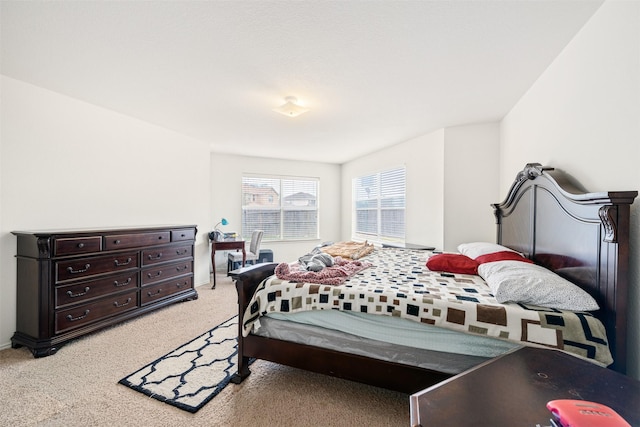 bedroom featuring light colored carpet