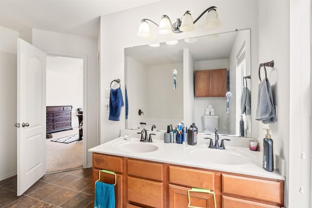 bathroom with double vanity, tile patterned flooring, and a sink