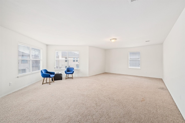 unfurnished room with light carpet