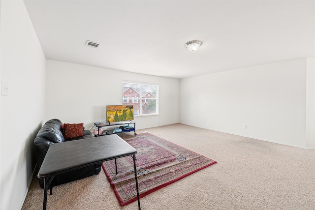 interior space with carpet and visible vents