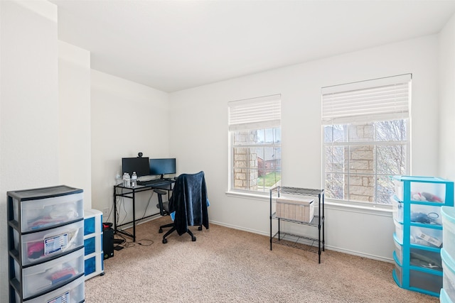 carpeted home office with baseboards