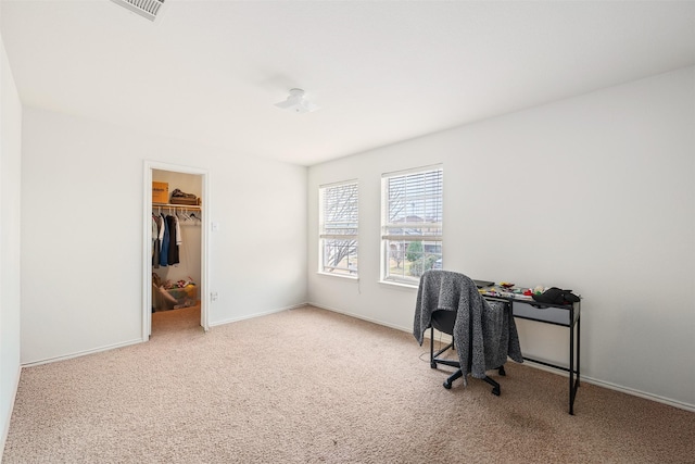 carpeted home office with baseboards and visible vents