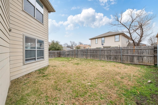 view of yard with a fenced backyard