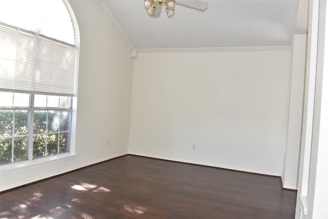 empty room with ornamental molding and dark wood-style floors