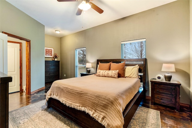 bedroom featuring ceiling fan and baseboards