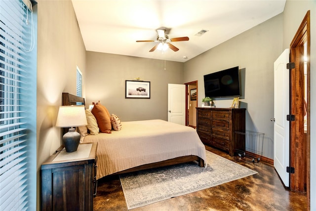 bedroom featuring concrete flooring, visible vents, and ceiling fan