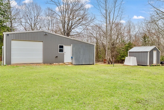 view of outbuilding featuring driveway and an outbuilding