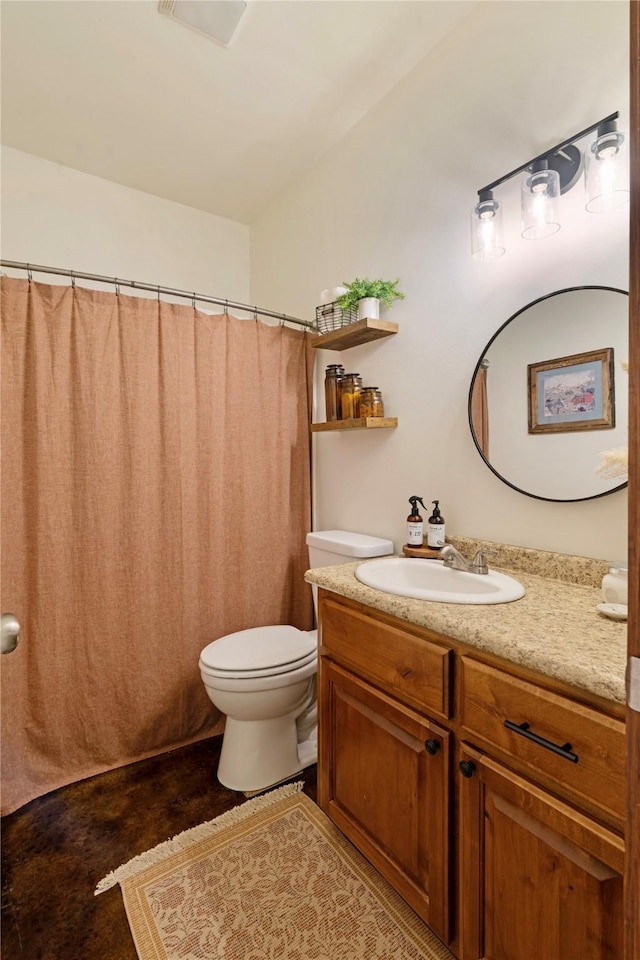 bathroom with vanity and toilet