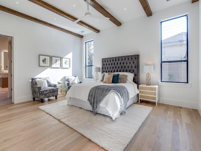 bedroom featuring beam ceiling, ceiling fan, baseboards, and wood finished floors