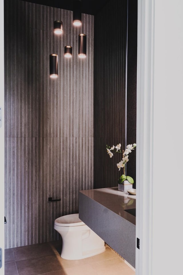 bathroom with tile patterned floors and toilet