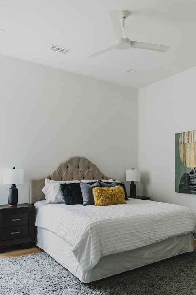 bedroom with visible vents and a ceiling fan