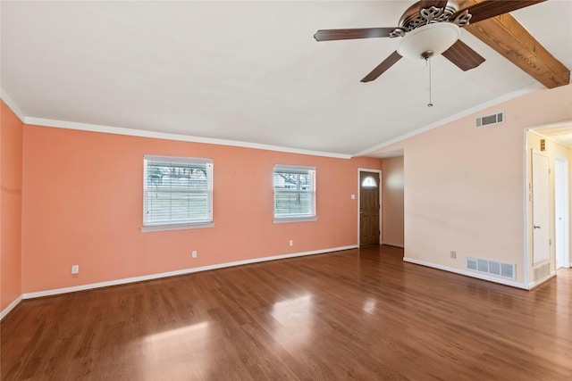 spare room with baseboards, visible vents, and wood finished floors