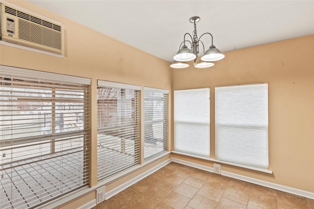 interior space featuring a chandelier and a wall mounted air conditioner