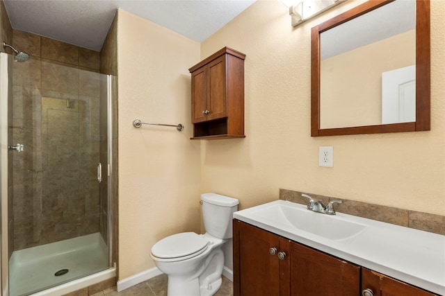 full bath with baseboards, a shower stall, toilet, and vanity