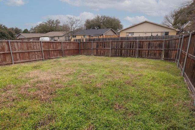 view of yard featuring a fenced backyard