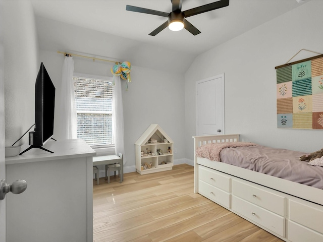 bedroom featuring vaulted ceiling, ceiling fan, baseboards, and light wood-style floors