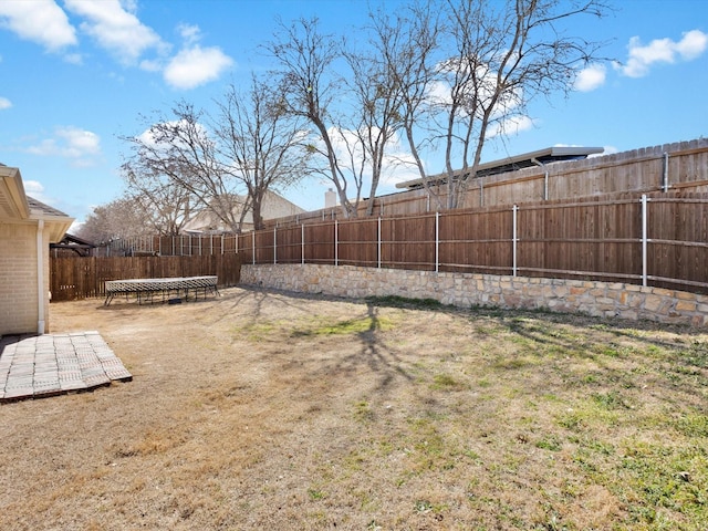 view of yard with a fenced backyard