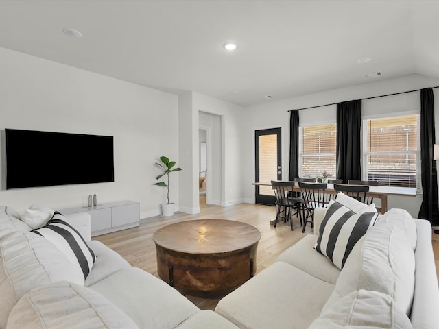 living room featuring recessed lighting, visible vents, stairway, light wood-style flooring, and baseboards