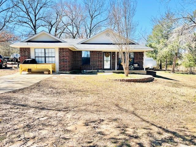 ranch-style house with brick siding