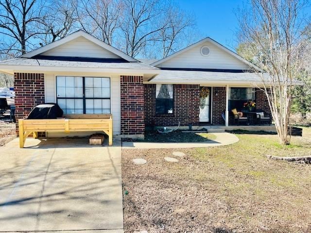 ranch-style home with brick siding