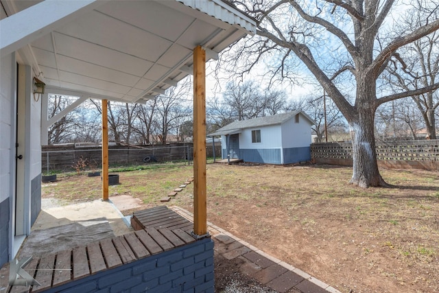 view of yard with an outbuilding and a fenced backyard