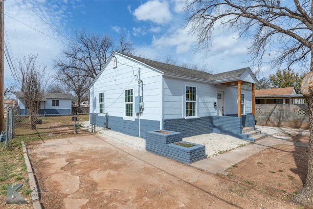 view of front of home with a gate and fence