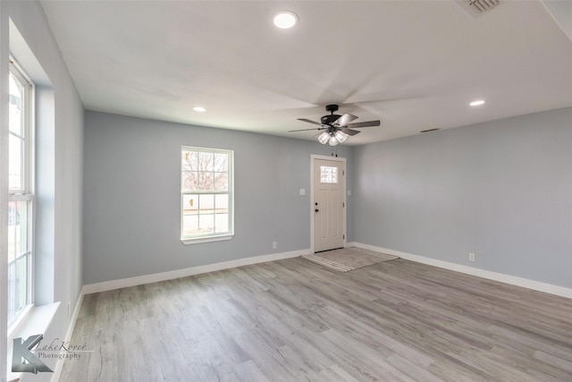 interior space with light wood finished floors, recessed lighting, visible vents, a ceiling fan, and baseboards