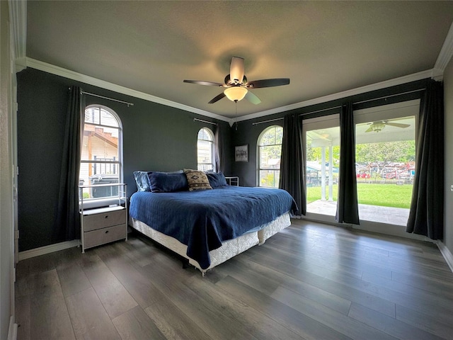 bedroom featuring a ceiling fan, access to outside, ornamental molding, and dark wood-style flooring