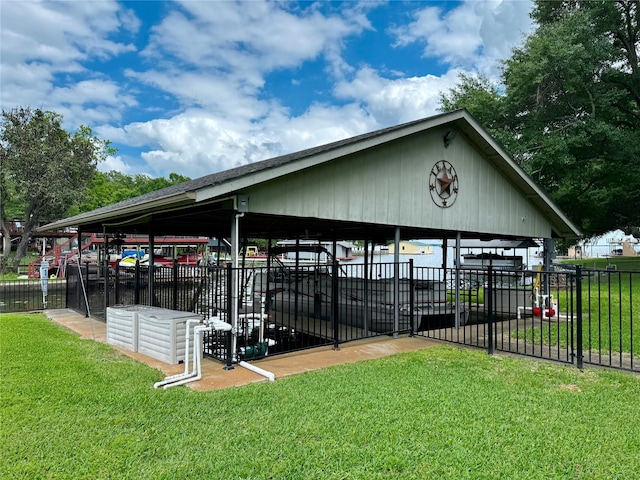 view of community with fence and a lawn