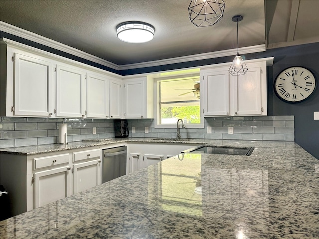 kitchen featuring tasteful backsplash, stone counters, white cabinets, and a sink