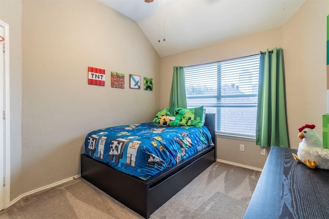 carpeted bedroom featuring lofted ceiling, baseboards, and ceiling fan