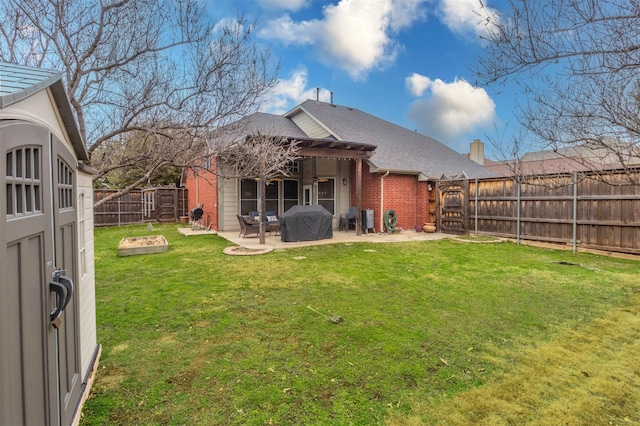 rear view of property with a pergola, a patio, a fenced backyard, a yard, and brick siding