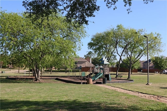 community jungle gym with a lawn