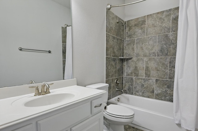 full bathroom featuring shower / bath combo, vanity, and toilet