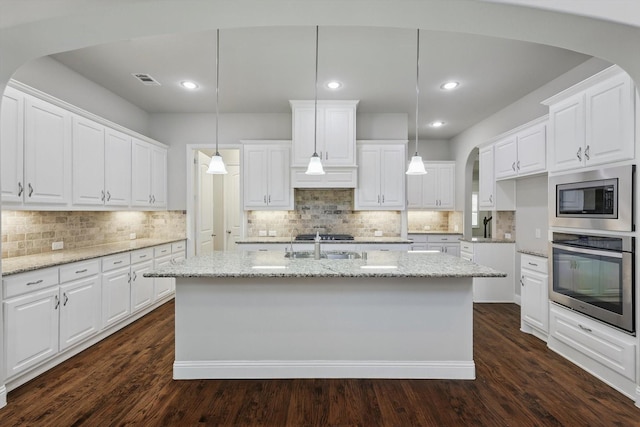 kitchen featuring dark wood-style floors, white cabinetry, and stainless steel appliances